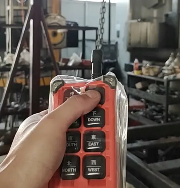 Operator using a wireless joystick remote control for heavy hydraulic equipment