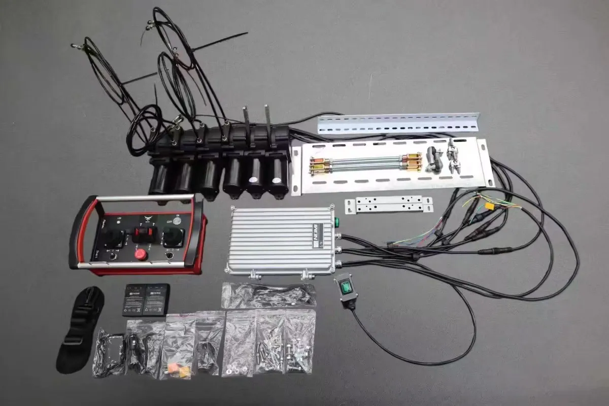 Complete set of Nomi hydraulic proportional wireless remote control components, including transmitter, receiver, control joysticks, wiring cables, and accessories.