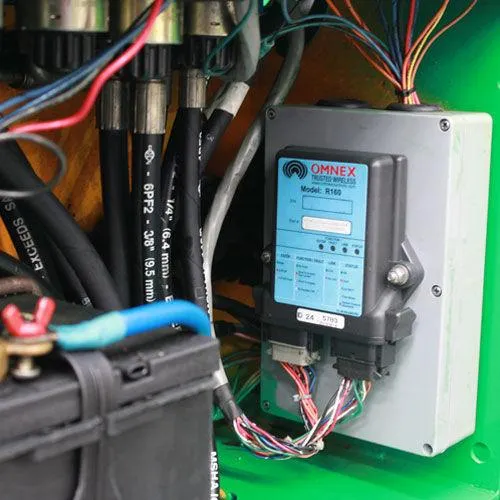 Wireless remote control receiver mounted on industrial hydraulic machinery
